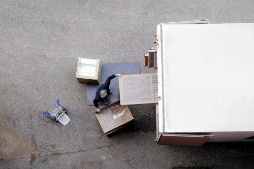 Furniture and boxes being unloaded during a Little Ilford relocation