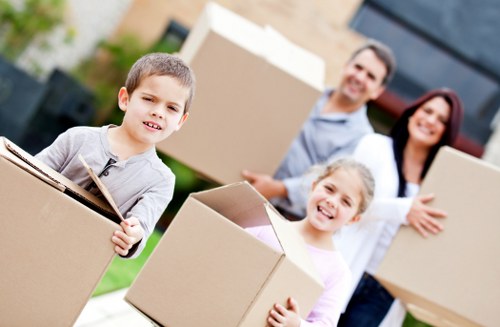 Careful loading of office furniture during a commercial move in Little Ilford