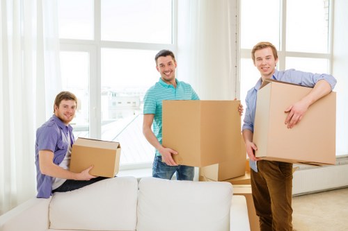 Furniture and boxes being loaded into a van for transport