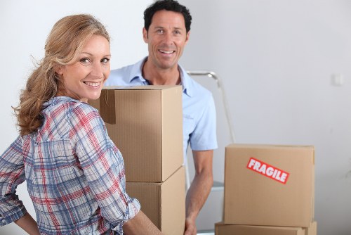 Packed boxes and furniture ready for a house move in Little Ilford