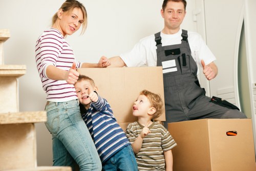 Removal team loading boxes and furniture for a local move